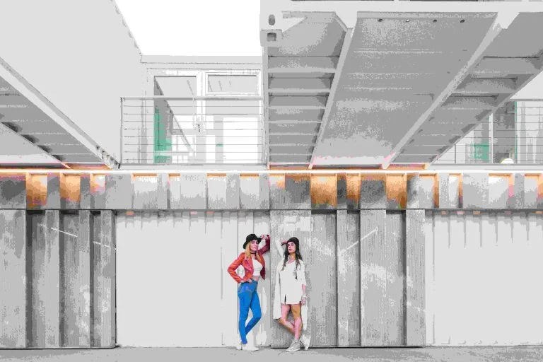 yong women posing near modern modular building