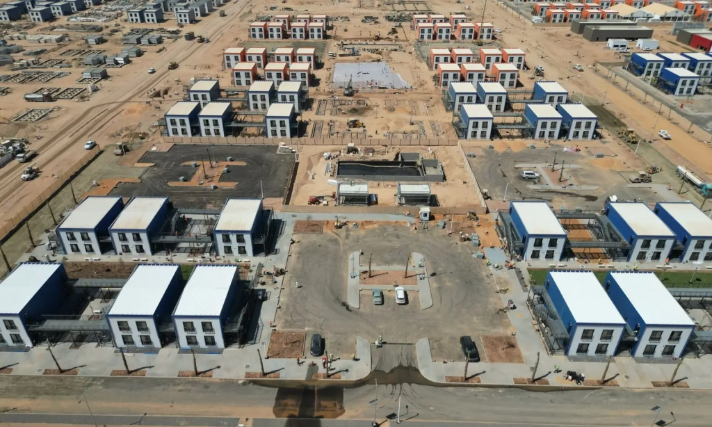 modular building transportation to remote project site using flatbed trucks