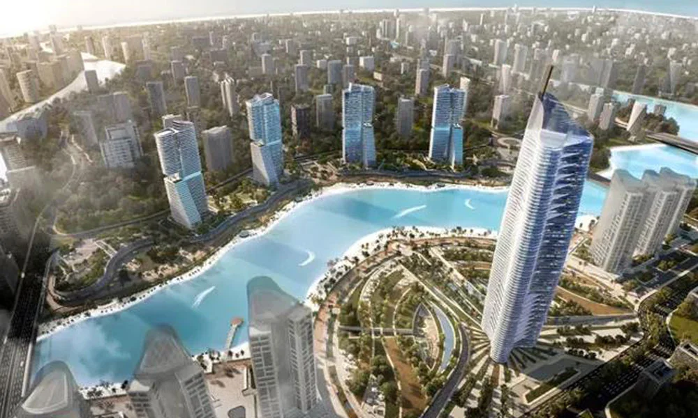 aerial rendering of a coastal apartment development with multiple high-rise buildings
