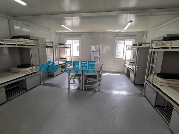 bunk bed dormitory room in modular military camp accommodation