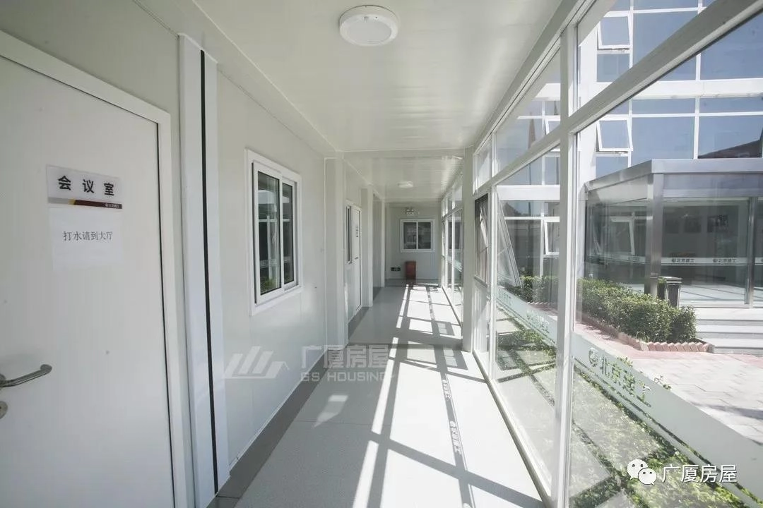 container house corridor with glass wall, room doors and natural daylight container house corridor with glass wall, room doors and natural daylight