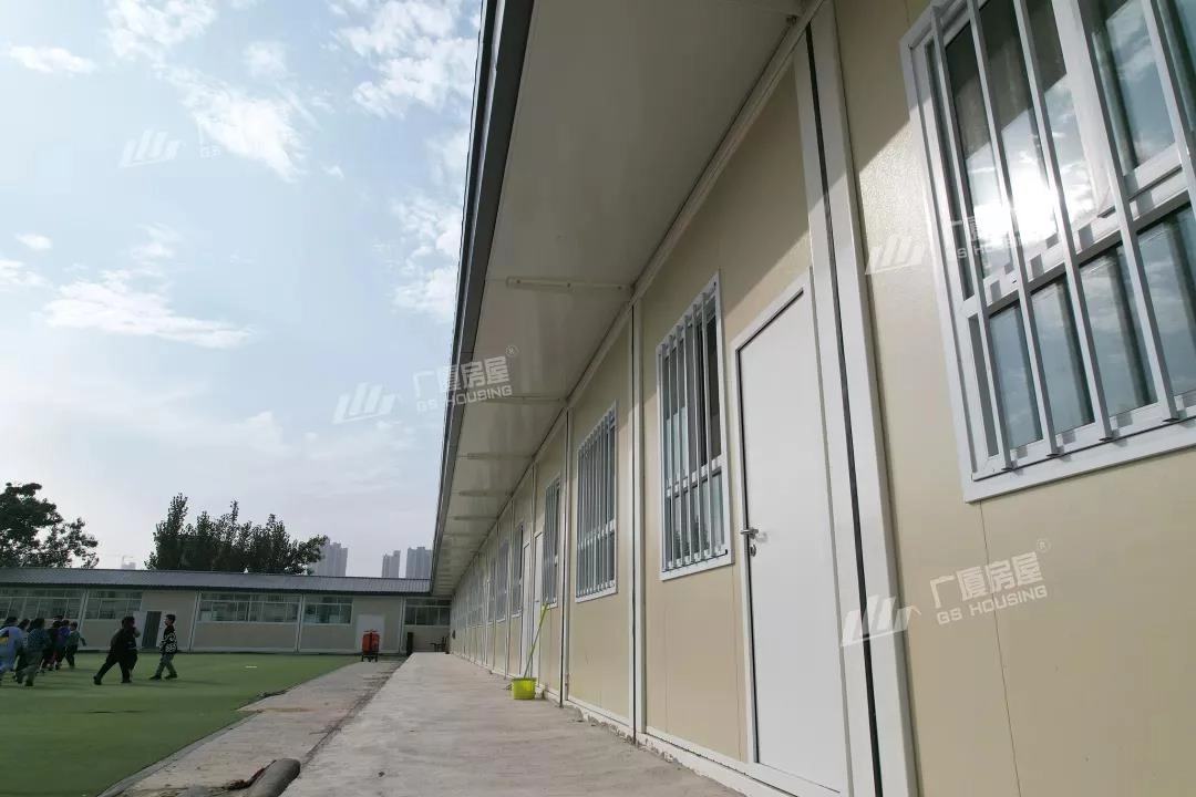 educational campus layout with central athletics field and classroom blocks