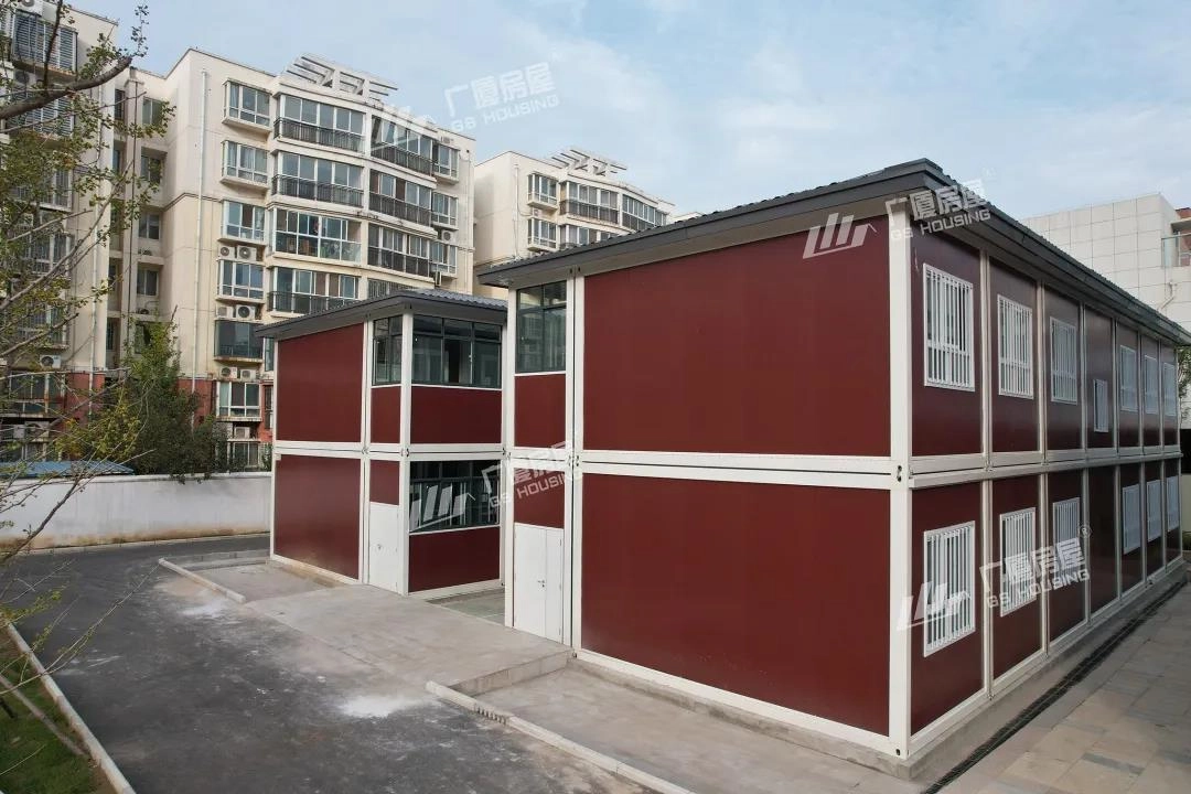 educational facility building exterior with red panel facade and parking area educational facility building exterior with red panel facade and parking area