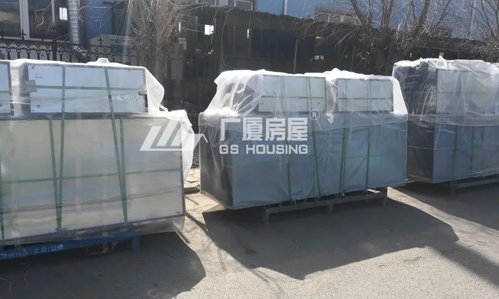 flat packed container house modules stacked for transportation