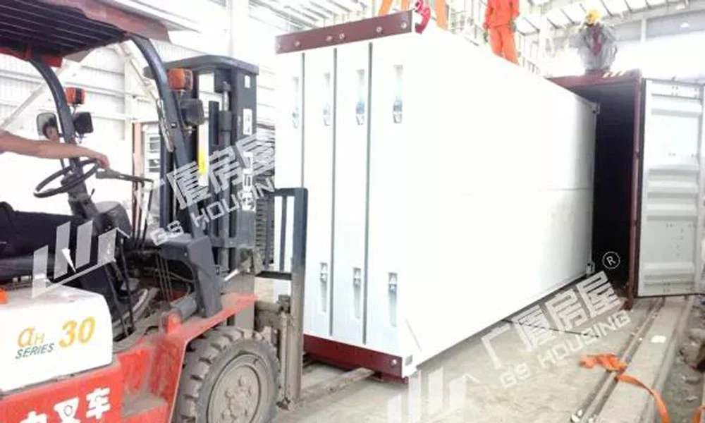 forklift loading flat packed container house modules for delivery