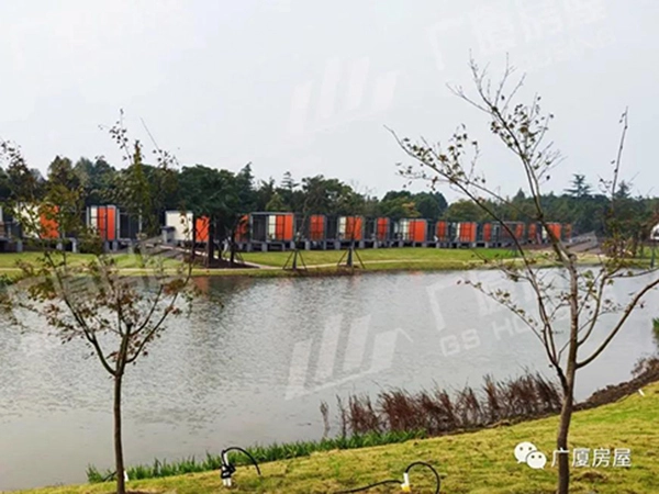 modular resort hotel buildings beside a lakeside landscape in Shanghai
