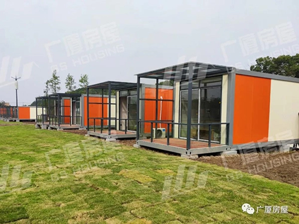 modular resort hotel unit with glass facade and outdoor terrace space