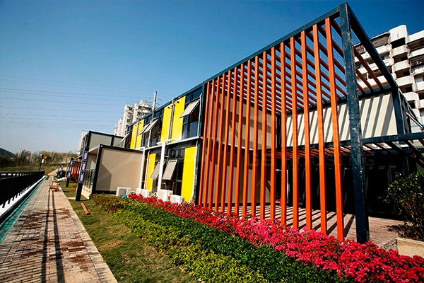 prefab container building facade with orange vertical sunshade panels prefab container building facade with orange vertical sunshade panels