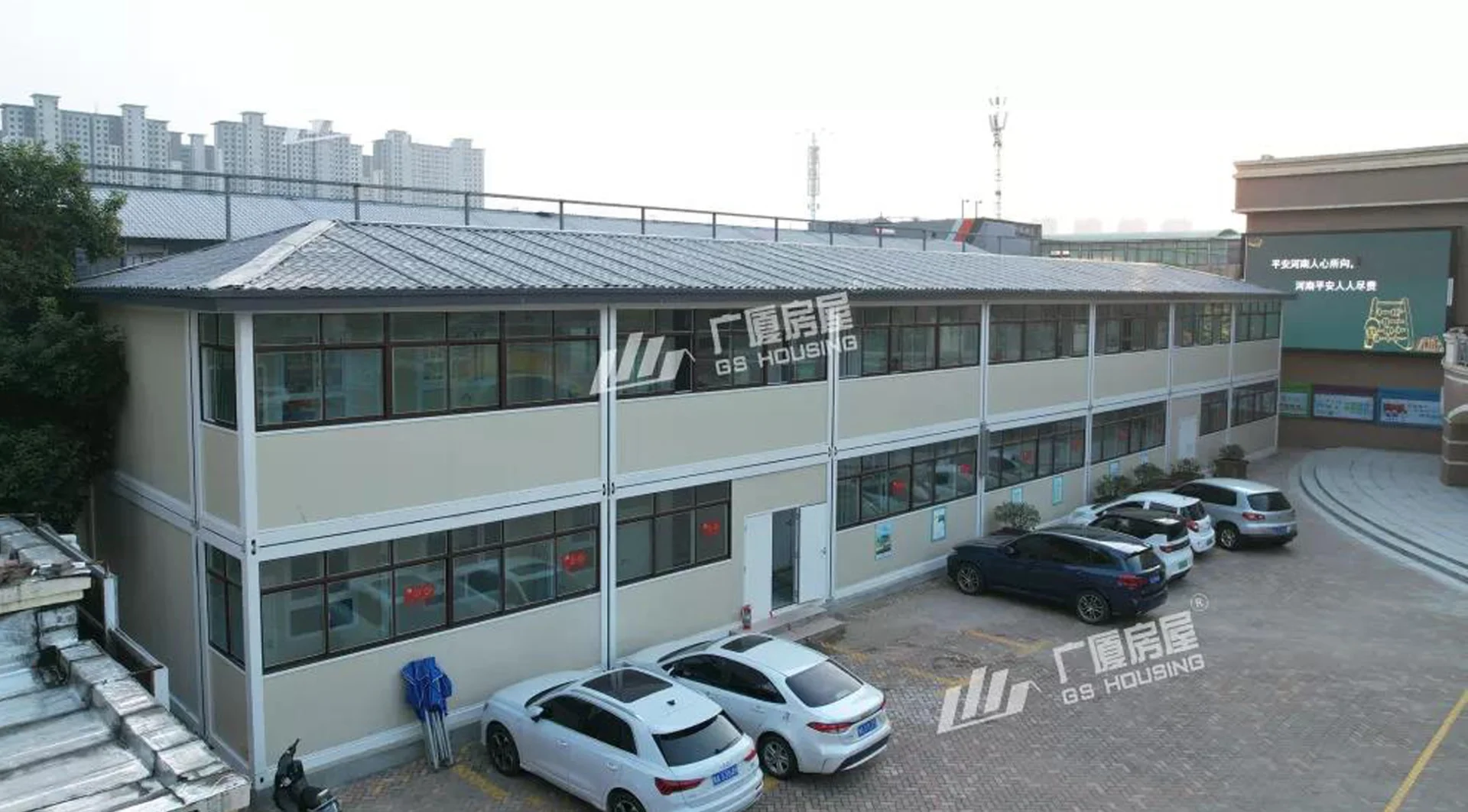 primary school campus building with modular classroom blocks and urban residential background primary school campus building with modular classroom blocks and urban residential background