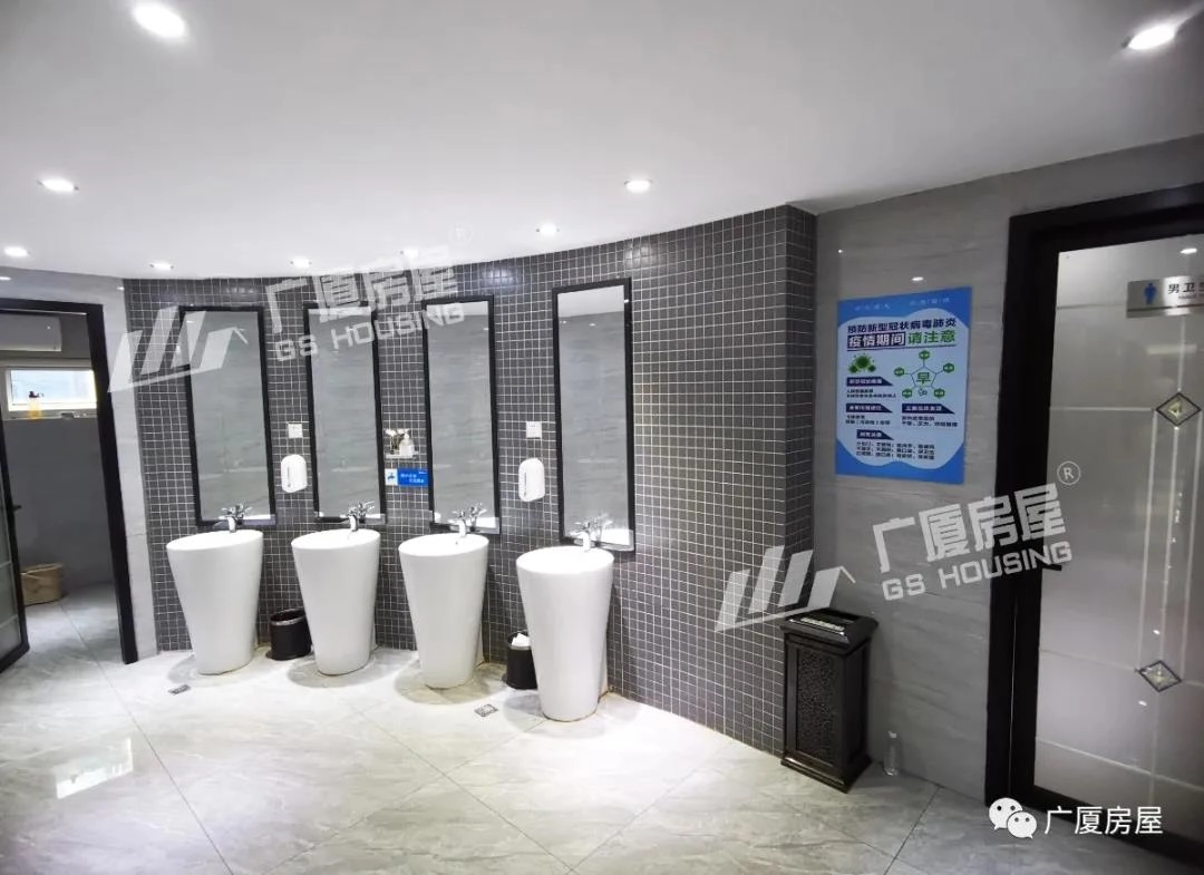 restroom facility with washbasins and tiled walls in modular commercial building project