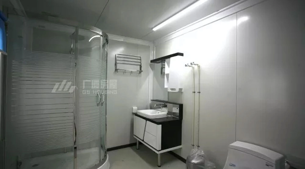 sanitary room inside modular building with shower, sink and toilet sanitary room inside modular building with shower, sink and toilet
