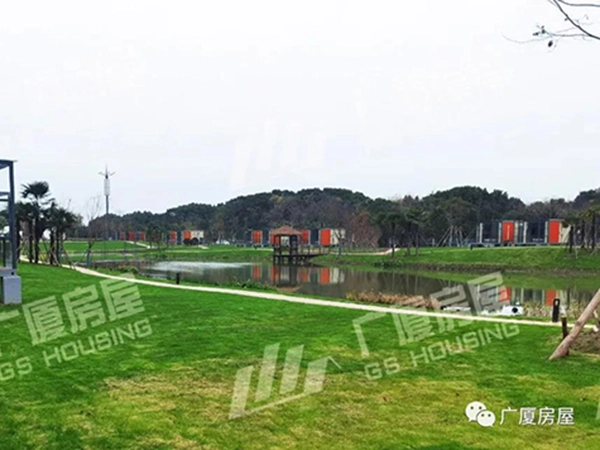 tourist resort hotel accommodation units with lake view and green lawn
