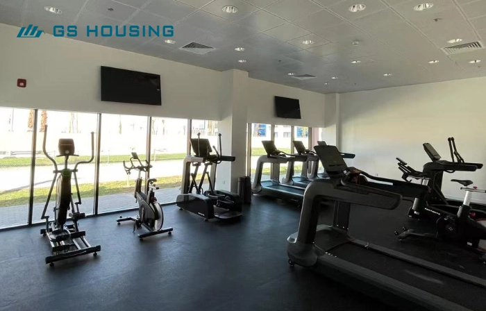 labor camp modular sports facility interior with gym equipment
