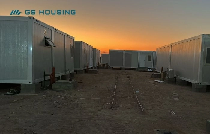 modular camp accommodation walkway at sunset for Oman remote project site
