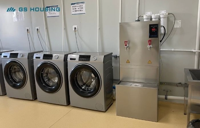 modular camp laundry room facility with washing machines for workforce accommodation