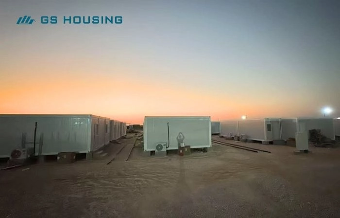 modular camp temporary workforce accommodation units during evening site installation
