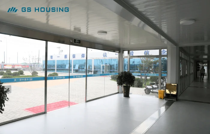 prefab construction camp interior corridor with glass wall and walkway