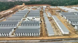 Aerial view of IPIP mining camp showing dormitory blocks, service buildings for dining and offices, and water treatment facilities