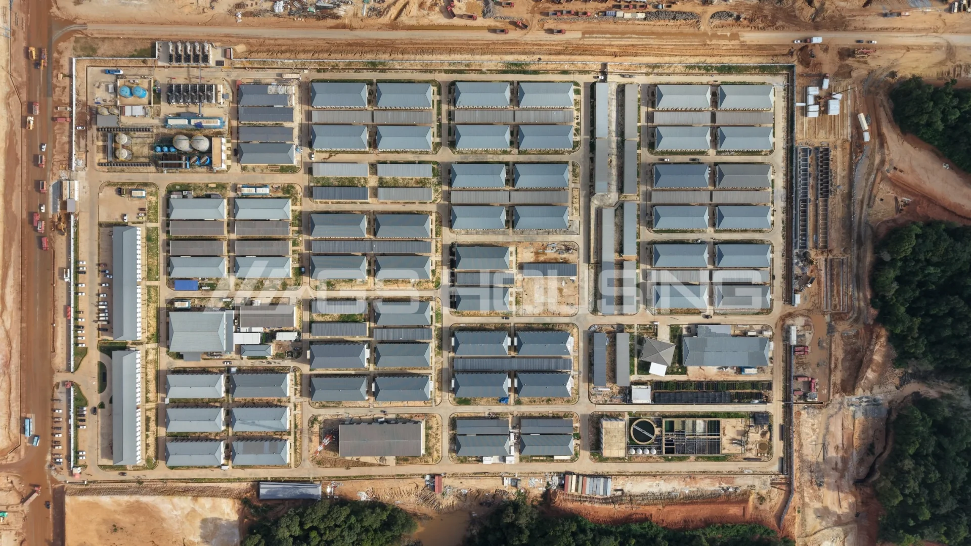Aerial view of the complete 1,158-unit IPIP mining camp accommodation site in Indonesia with organized dormitory blocks and supporting facilities