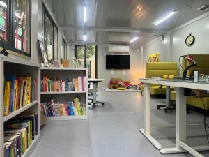 Completed interior of a modular classroom with bookshelves, reading area, TV and teaching facilities at Tai Po school