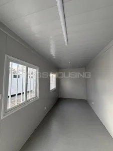 Empty interior of a standard flat pack container house before accommodation fit-out