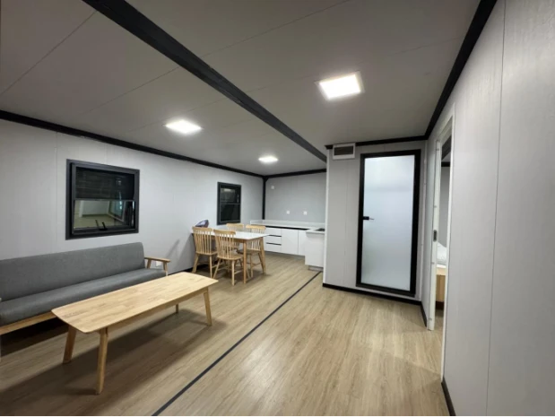 Interior of 20ft expandable container home in Aruba with open plan living kitchen layout