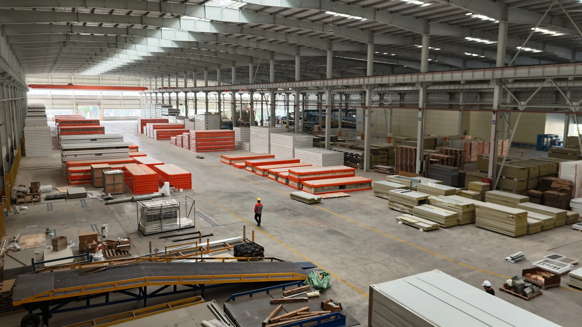 GS Housing factory interior with prefabricated wall and roof panels