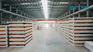 Interior of GS Housing factory showing stacked prefabricated building panels